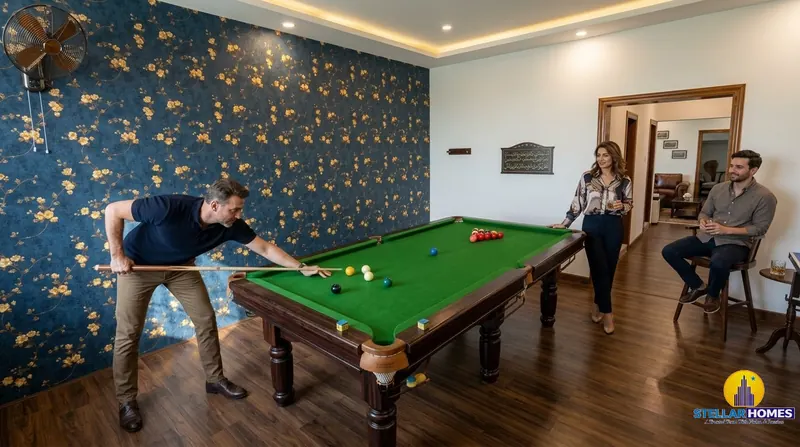 Residents playing billiards on the clubhouse pool table at Stellar Mulberry, with warm ambient lighting and patterned wallpaper in the lounge